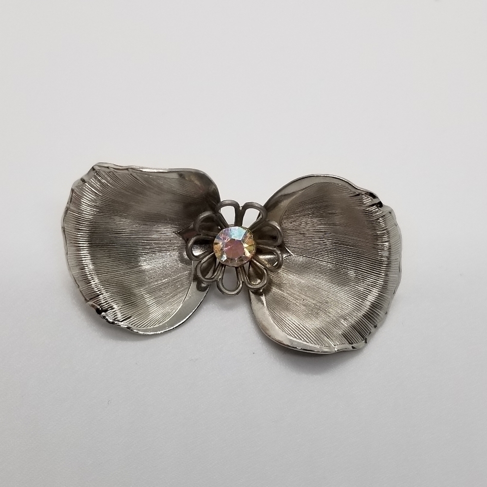 silver tone dogwood flower brooch with AB rhinestone